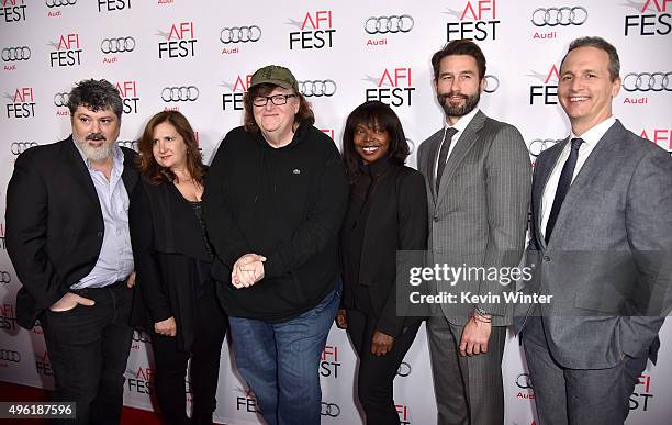 Producers Carl Deal and Tia Lessin, filmmaker Michael Moore, AFI FEST Director Jacqueline Lyanga and Jason Janego and Tom Quinn attend the...