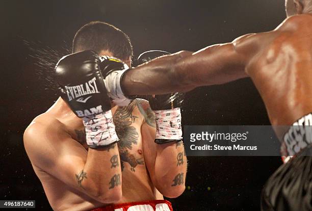 Brandon Rios takes a punch from WBO welterweight champion Timothy Bradley Jr. During their title fight at the Thomas & Mack Center on November 7,...