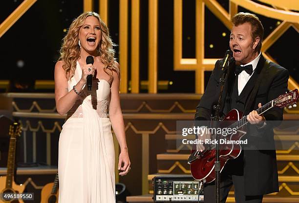 Host Jennifer Nettles and guitarist Brian Setzer perform during the CMA 2015 Country Christmas on November 7, 2015 in Nashville, Tennessee.
