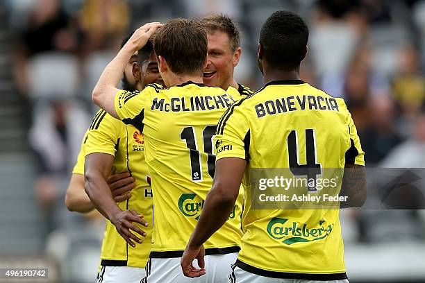 Phoenix team mates celebrate a goal from Michael McGilnchey during the round five A-League match between the Central Coast Mariners and the...