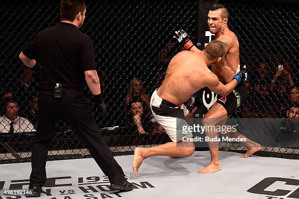 Vitor Belfort of Brazil punches Dan Henderson of the United States in their middleweight bout during the UFC Fight Night Belfort v Henderson on...