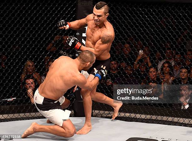 Vitor Belfort of Brazil punches Dan Henderson of the United States in their middleweight bout during the UFC Fight Night Belfort v Henderson on...