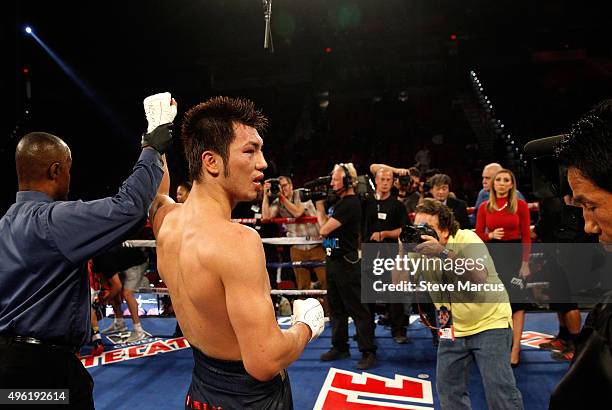 Ryota Murata has his arm raised by referee Kenny Bayless after beating Gunnar Jackson by unanimous decision in a middleweight fight at the Thomas &...