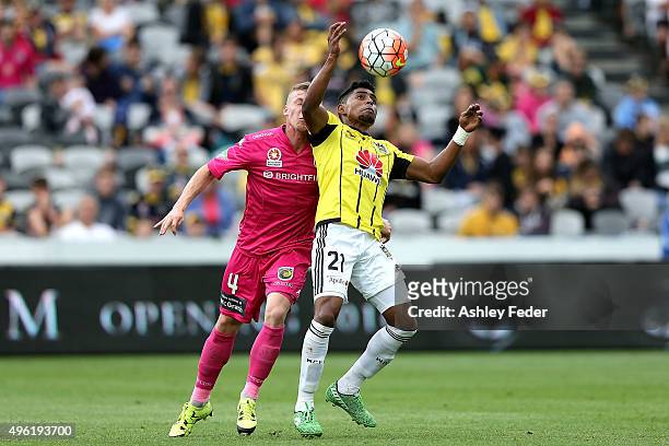 Roy Krishna of the Phoenix contests the ball against Jacob Poscoliero of the Mariners during the round five A-League match between the Central Coast...