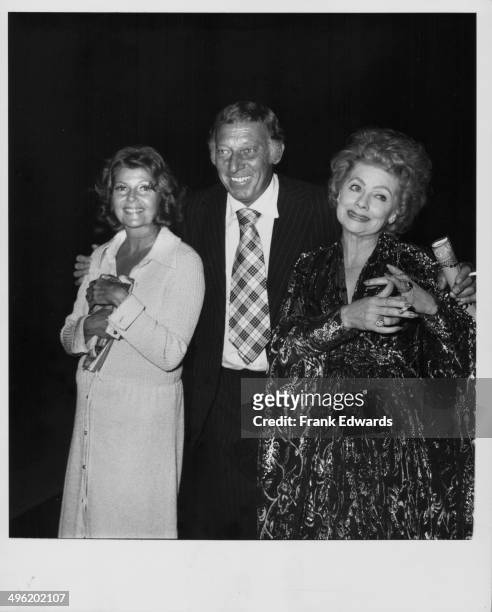 Actors Rita Hayworth and Lucille Ball, with comedian Gary Morton, at the Dorothy Chandler Pavilion for a performance of 'Gigi', Los Angeles, July...