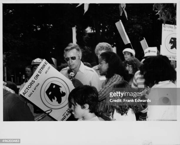 Actor Charlton Heston talking to the press on the picket line, at the Screen Actors Guild strike, Universal Studios, Los Angeles, August 1980.