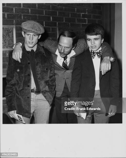 Actor Rance Howard with his arms around his sons Ron and Clint, also actors, at a screening of the movie 'Where the Lilies Bloom', at the Screen...