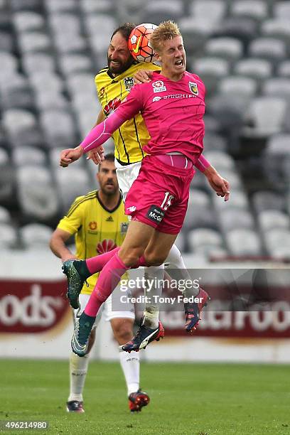 Josh Bingham of the Mariners contests the ball with his Phoenix opponent during the round five A-League match between the Central Coast Mariners and...