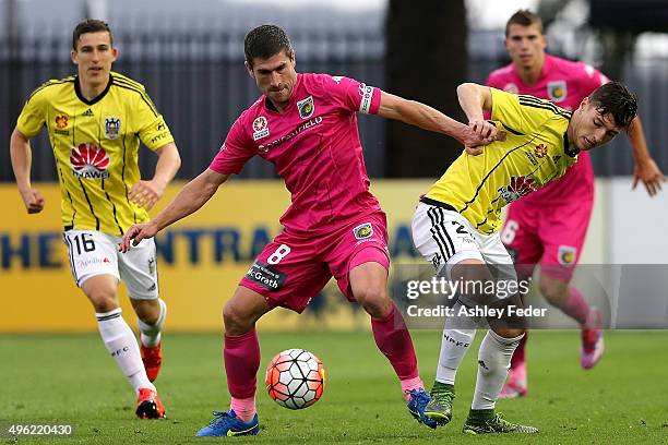Nick Montgomery of the Mariners contests the ball against the Phoenix defence during the round five A-League match between the Central Coast Mariners...