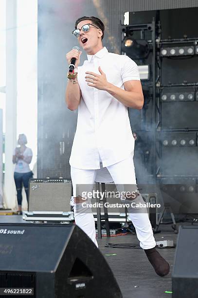 Nesty Galguera of Grupo Treo performs onstage at the iHeartRadio Fiesta Latina pre-show presented by Sprint at Bayfront Park Amphitheater on November...