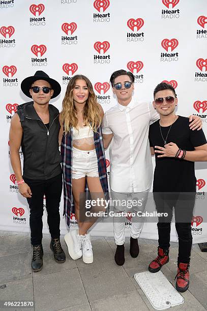 Leo Herrera, Sofia Reyes, Nesty Galguera, and Monti Montanez pose at the iHeartRadio Fiesta Latina pre-show presented by Sprint at Bayfront Park...