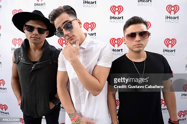 Leo Herrera, Nesty Galguera, and Monti Montanez of Grupo Treo pose at the iHeartRadio Fiesta Latina pre-show presented by Sprint at Bayfront Park...