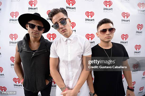 Leo Herrera, Nesty Galguera, and Monti Montanez of Grupo Treo pose at the iHeartRadio Fiesta Latina pre-show presented by Sprint at Bayfront Park...