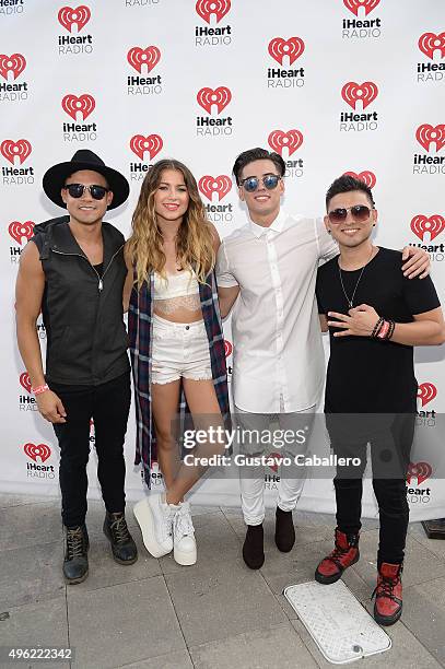 Leo Herrera, Sofia Reyes, Nesty Galguera, and Monti Montanez pose at the iHeartRadio Fiesta Latina pre-show presented by Sprint at Bayfront Park...