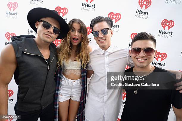 Leo Herrera, Sofia Reyes, Nesty Galguera, and Monti Montanez pose at the iHeartRadio Fiesta Latina pre-show presented by Sprint at Bayfront Park...