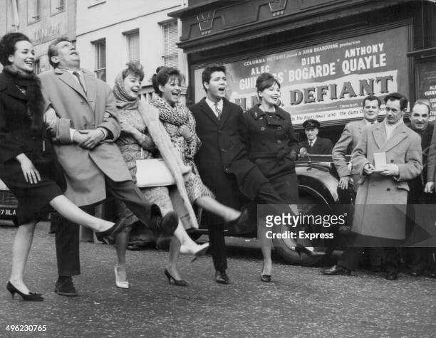Film stars Sylvia Sims, Peter Finch, Janet Munro, Claudia Cardinale, Cliff Richard and Leslie Caron, lined up outside Odeon Cinema, Leicester Square,...