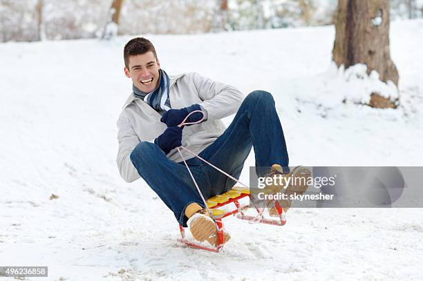 Man Riding Sled 7,582 Man Sledding Stock Photos, High-Res Pictures, and Images - Getty ...