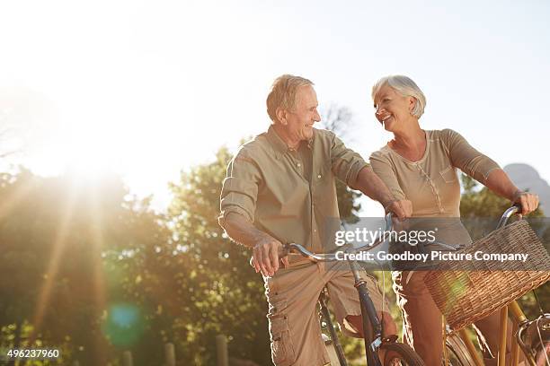 they love taking bike rides together - couple cycling bildbanksfoton och bilder