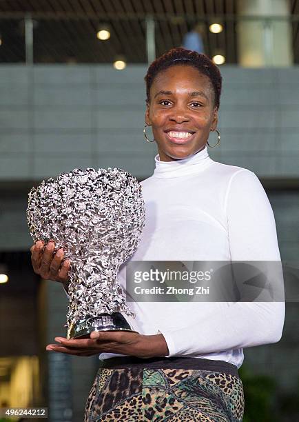 Venus Williams of USA poses with her trophy outside the stadium after winning the final match against Karolina Pliskova of Czech Republic on day 7 of...