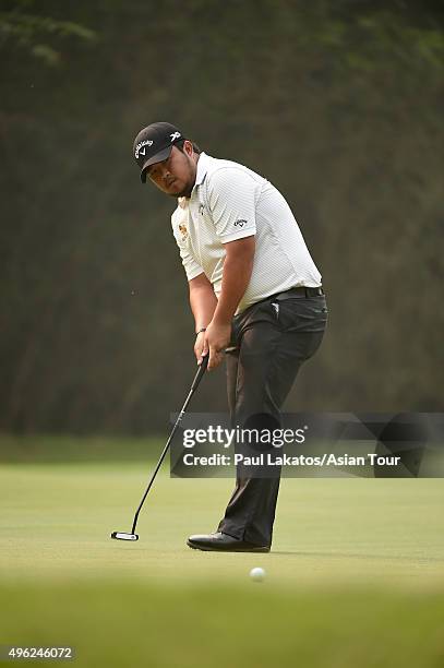 Namchok Tantipokhakul of Thailand plays a shot during round four of the Panasonic Open India at Delhi Golf Club on November 8, 2015 in New Delhi,...