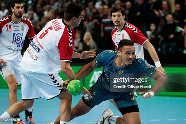 Rogerio Ferreira of Brazil challenges for the ball with Zarko Sesum of Serbia during the Handball Supercup between Brazil and Serbia on November 8,...