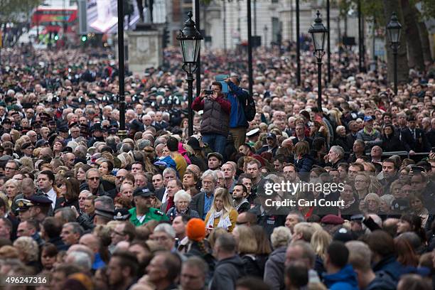 Spectators look on during the annual Remembrance Sunday Service at the Cenotaph on Whitehall on November 8, 2015 in London, United Kingdom. People...