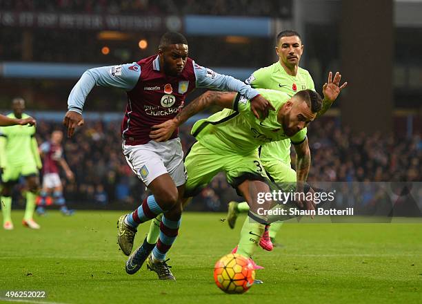 Charles N'Zogbia Of Aston Villa is challenged by Nicolas Otamendi of Manchester City during the Barclays Premier League match between Aston Villa and...