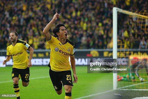 Shinji Kagawa of Dortmund celebrates the first goal during the Bundesliga match between Borussia Dortmund and FC Schalke 04 at Signal Iduna Park on...