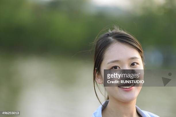 woman in riverside - korean ethnicity stock pictures, royalty-free photos & images