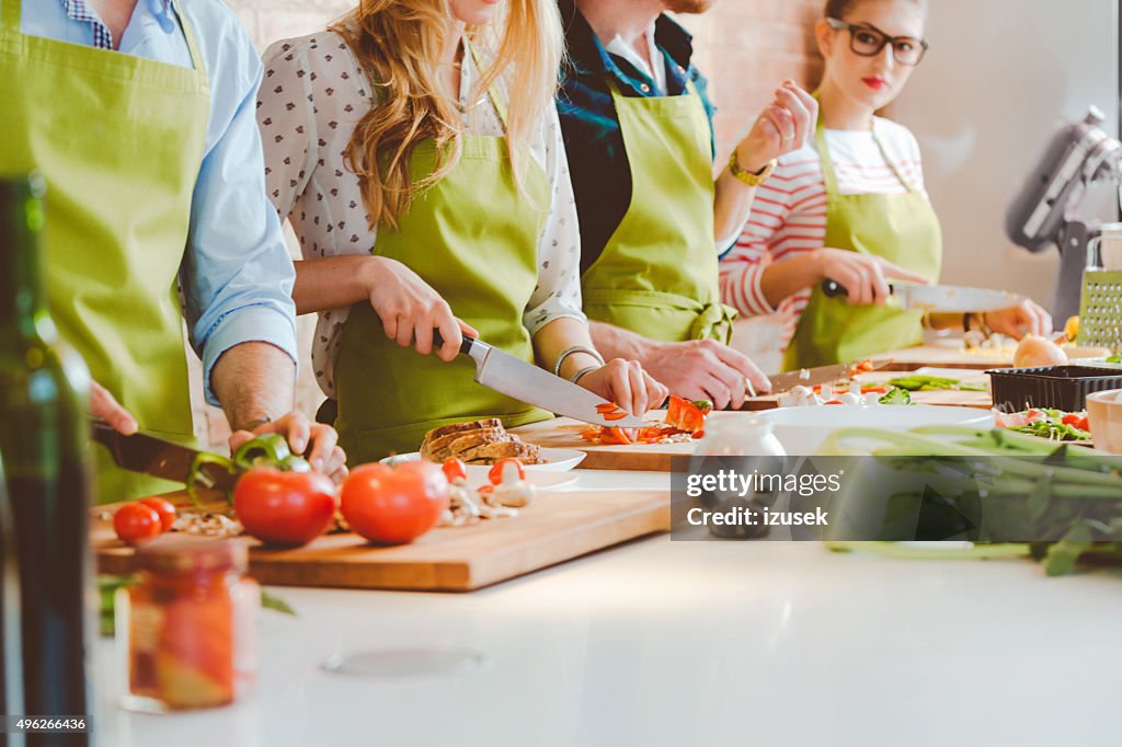 Four people taking part in cooking class