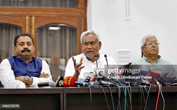 Janata Dal-United leader Nitish Kumar and Rashtriya Janta Dal leader Lalu Prasad Yadav and Ashok Choudhary , President of the Bihar Pradesh Congress...