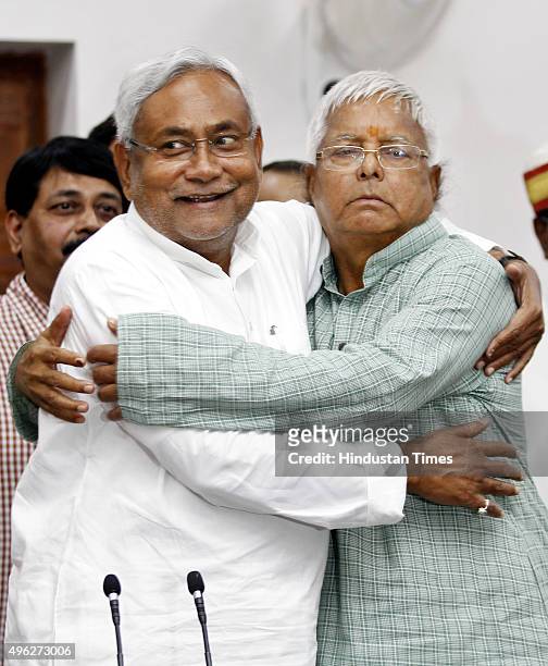 Janta Dal leader Nitish Kumar and Rashtriya Janta Dal leader Lalu Prasad Yadav celebrate during a press conference after landslide victory in Bihar...