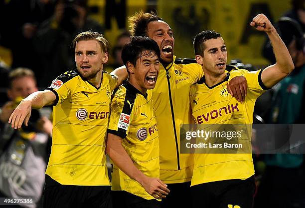 Marcel Schmelzer, Shinji Kagawa, Pierre-Emerick Aubameyang and Henrikh Mkhitaryan of Dortmund celebrates after winning the Bundesliga match between...