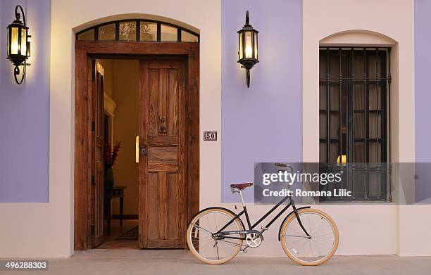 Bycicle at the entrance of a colonial house in Todos Santos, Pueblo Magico, Baja California Sur, Mexico