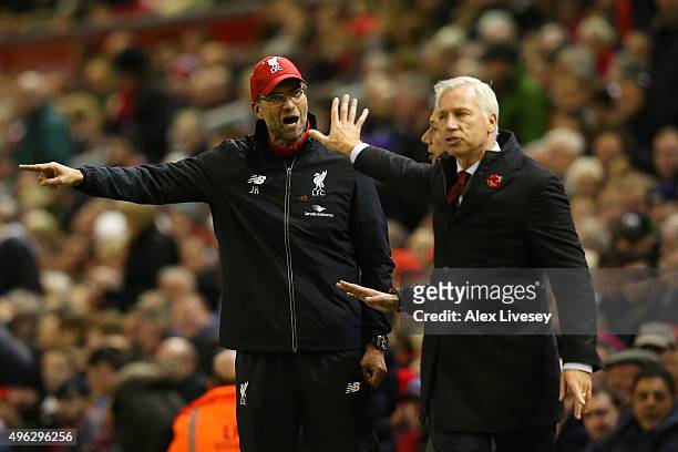 Jurgen Klopp, Manager of Liverpool argues with Alan Pardew, Manager of Crystal Palace during the Barclays Premier League match between Liverpool and...