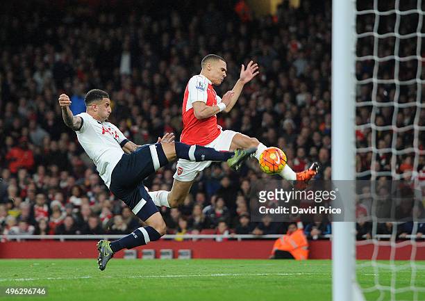 Kieran Gibbs scores Arsenal's goal under pressure from Kyle Walker of Tottenham during the Barclays Premier League match between Arsenal and...