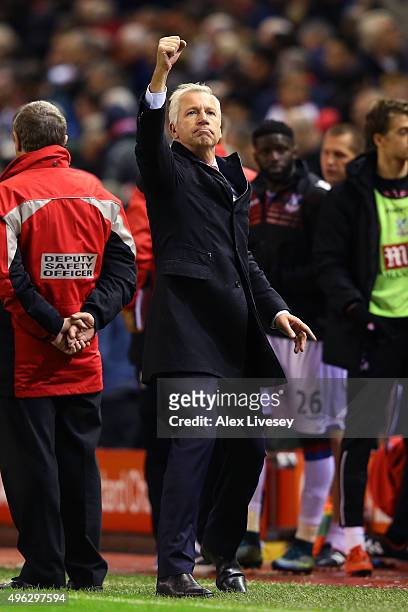 Alan Pardew, Manager of Crystal Palace celebrates towards the fans following the Barclays Premier League match between Liverpool and Crystal Palace...