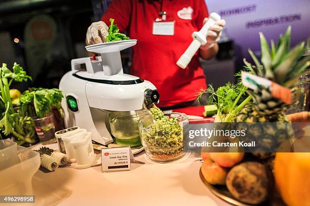 The staff at a stand of the Keimling Naturkost GmbH blends vegetables and fruits in a mixer of the company during a demonstration at the Veggie World...