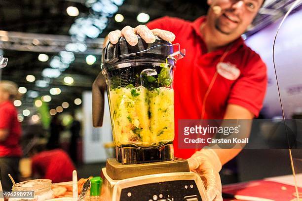 The staff at a stand of the Keimling Naturkost GmbH blends vegetables and fruits in a mixer of the company during a demonstration at the Veggie World...
