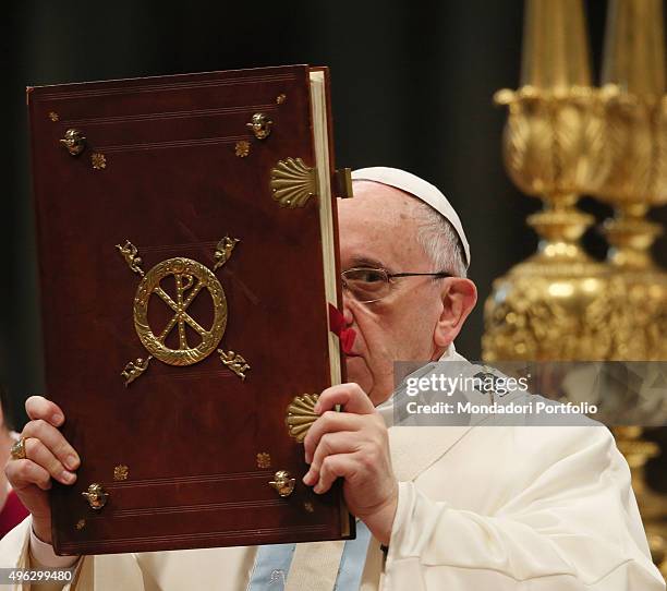 Pope Francis holding the Gospel Book while celebrating the mass for the Solemnity of Blessed Virgin Mary, Mother of God and for the 48th World Day of...
