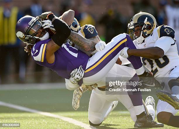 James Laurinaitis and Lamarcus Joyner of the St. Louis Rams tackle Cordarrelle Patterson of the Minnesota Vikings during the first quarter of the...