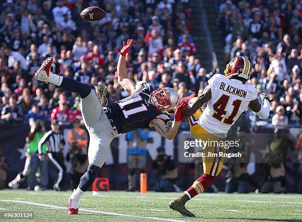 Julian Edelman of the New England Patriots can't catch a pass as Will Blackmon of the Washington Redskins defends in the first quarter at Gillette...