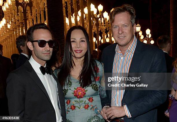 Artist Alex Israel, Art Film Gala co-chair and LACMA Trustee Eva Chow, wearing Gucci, and director Doug Aitken attend LACMA 2015 Art+Film Gala...