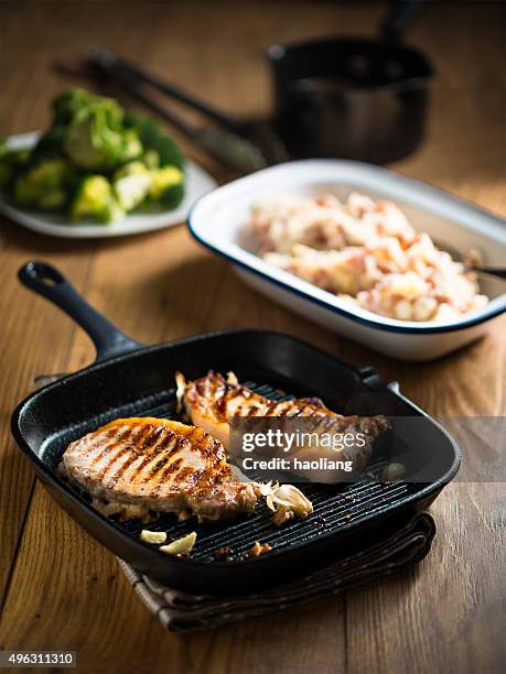 grilled pork chop - griddle stock pictures, royalty-free photos & images