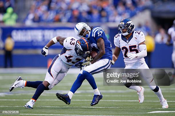 Ward of the Denver Broncos tackles on T.Y Hilton of the Indianapolis Colts in the first quarter of the game at Lucas Oil Stadium on November 8, 2015...