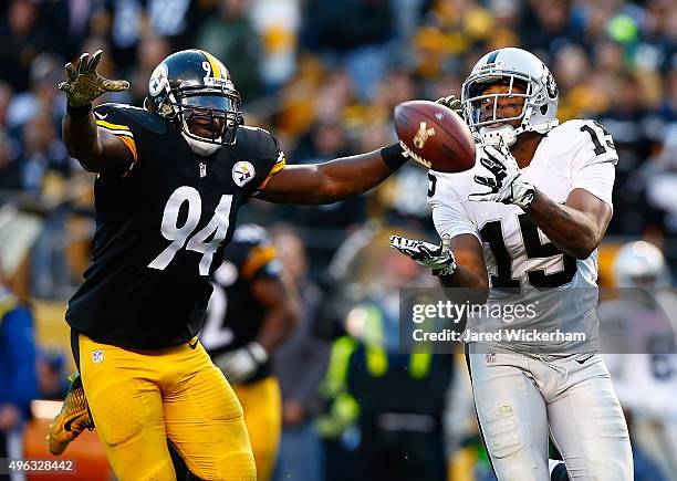 Michael Crabtree of the Oakland Raiders catches a game tying touchdown pass in front of Lawrence Timmons of the Pittsburgh Steelers in the 4th...