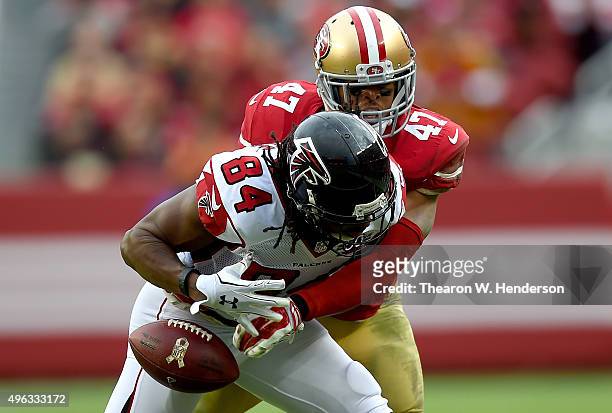 Marcus Cromartie of the San Francisco 49ers breaks up this pass to Roddy White of the Atlanta Falcons during the third quarter of their NFL football...