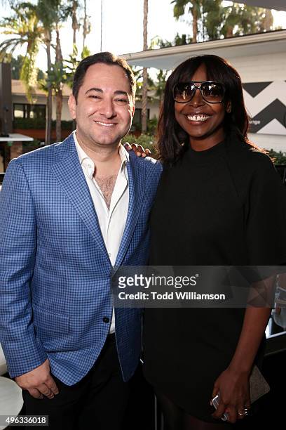 S Scott Feinberg and AFI FEST Director Jacqueline Lyanga attend the photo call for 'Indie Contenders Roundtable presented by The Hollywood Reporter'...