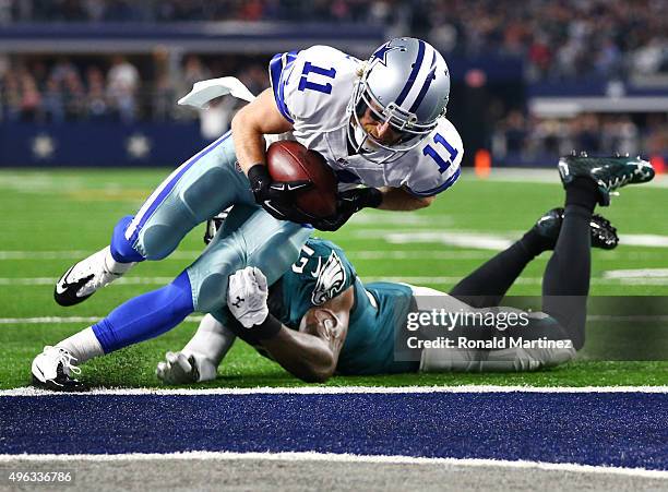 Cole Beasley of the Dallas Cowboys takes the ball across the goal line to score a touchdown against Malcolm Jenkins of the Philadelphia Eagles in the...