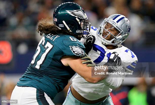 Dennis Kelly of the Philadelphia Eagles goes against Greg Hardy of the Dallas Cowboys in the first half at AT&T Stadium on November 8, 2015 in...